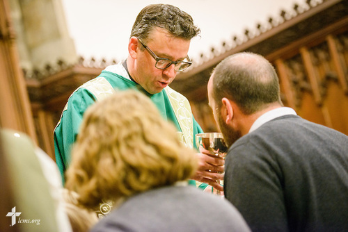The Rev. Eric R. Andræ distributes the sacrament during worship at First Trinity EvangelicalLutheran Church on Sunday, Nov. 20, 2016, in Pittsburgh. LCMS Communications/Erik M. Lunsford