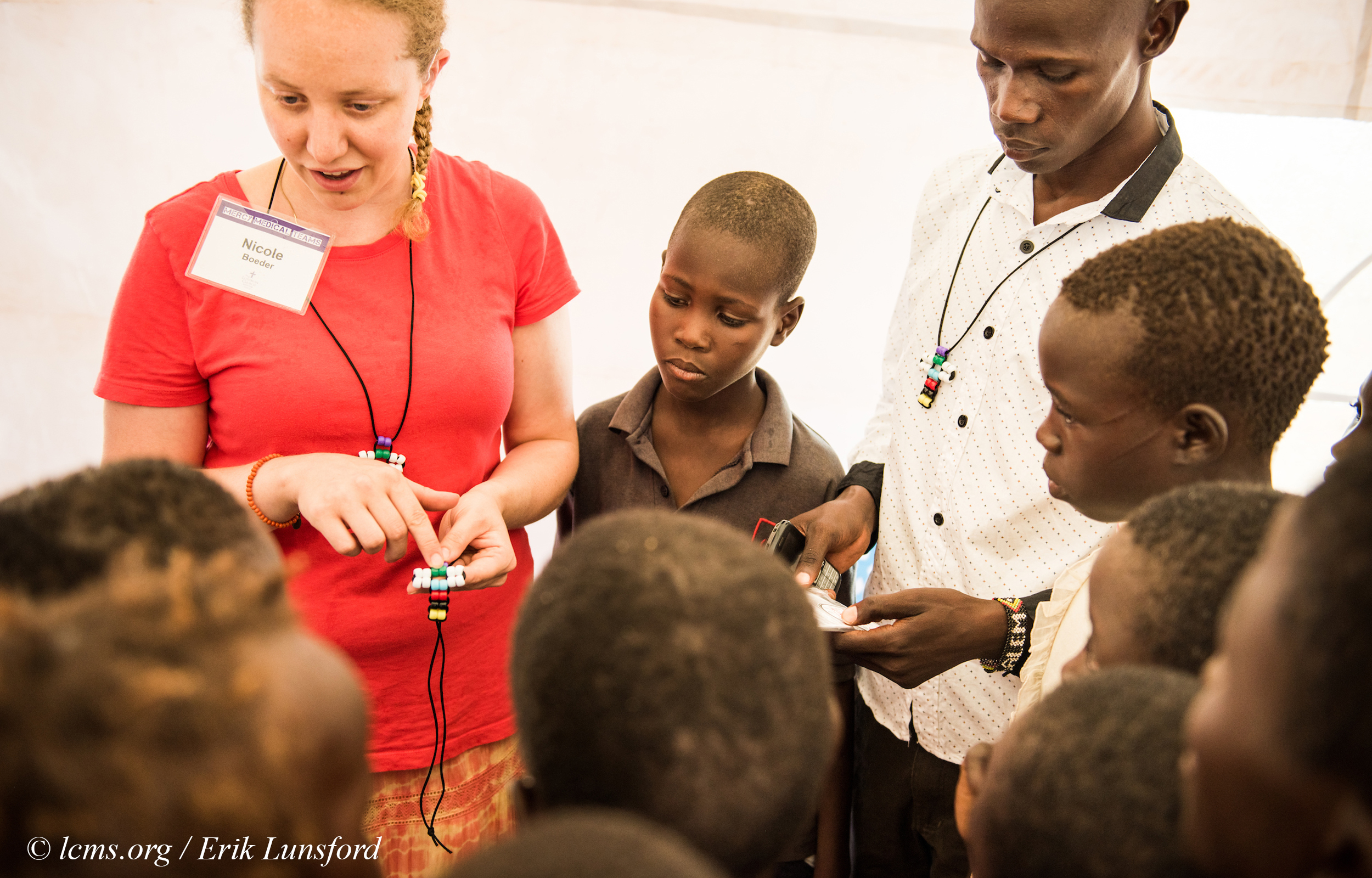 Nicole Boeder, a teacher and a member of Trinity Lutheran Church, Springfield, Ill., witnesses to children about Jesus during the LCMS Mercy Medical Team on Tuesday, June 21, 2016, in Nataparkakono, a village in Turkana, Kenya. LCMS Communications/Erik M. Lunsford