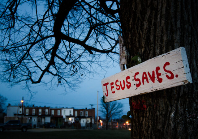 A sign nailed to a tree punctuates the dusk Thursday, March27, 2014, outside a neighborhood in Baltimore, Md. LCMS Communications/Erik M. Lunsford