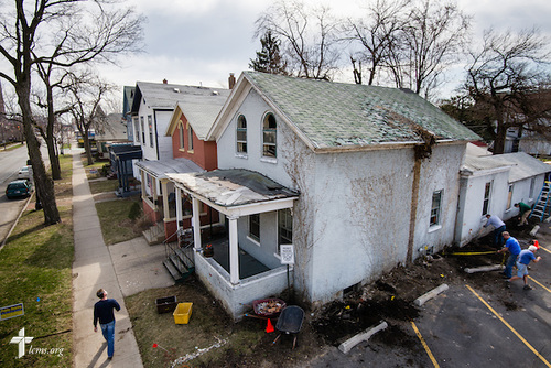 Volunteers and members of Emmanuel Lutheran Church rehab a vacant and abandoned home adjacent to the church on Saturday, April 12, 2014, in Ft. Wayne, Ind. The rehab is part of the "Helping Hand" initiative from the LCMS National Housing Support Corporation (NHSC) and a coalition of church partners, including Redeemer Lutheran, Emmanuel Lutheran, Zion Lutheran, and St. Peter's Catholic. The initiative is a multi-neighborhood safe housing and repair effort that plans to support nine low-income and/or elderly homeowners. LCMS Communications/Erik M. Lunsford
