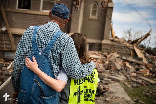 Glennis Stern hugs Jennifer Bucklew, the spouse of the Rev. Brian Bucklew, pastor at Zion Lutheran Church, as they reflect on the damage to their church on Tuesday, May 12, 2015, in Delmont, S.D. A tornado swept through the area on Sunday and destroyed Zion along with nearby buildings. LCMS Communications/Erik M. Lunsford
