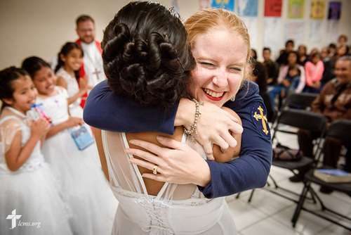 Naomi, a newly confirmed member, lifts up Deaconess Caitlin Worden de Ramírez, LCMS career missionary to Peru, in a joyful hug following a worship service with confirmations at Castillo Fuerte on Saturday, Nov. 4, 2017, in the La Victoria district of Lima, Peru. Ramirez is a big part of Naomi and her fellow confirmands' lives. LCMS Communications/Erik M. Lunsford