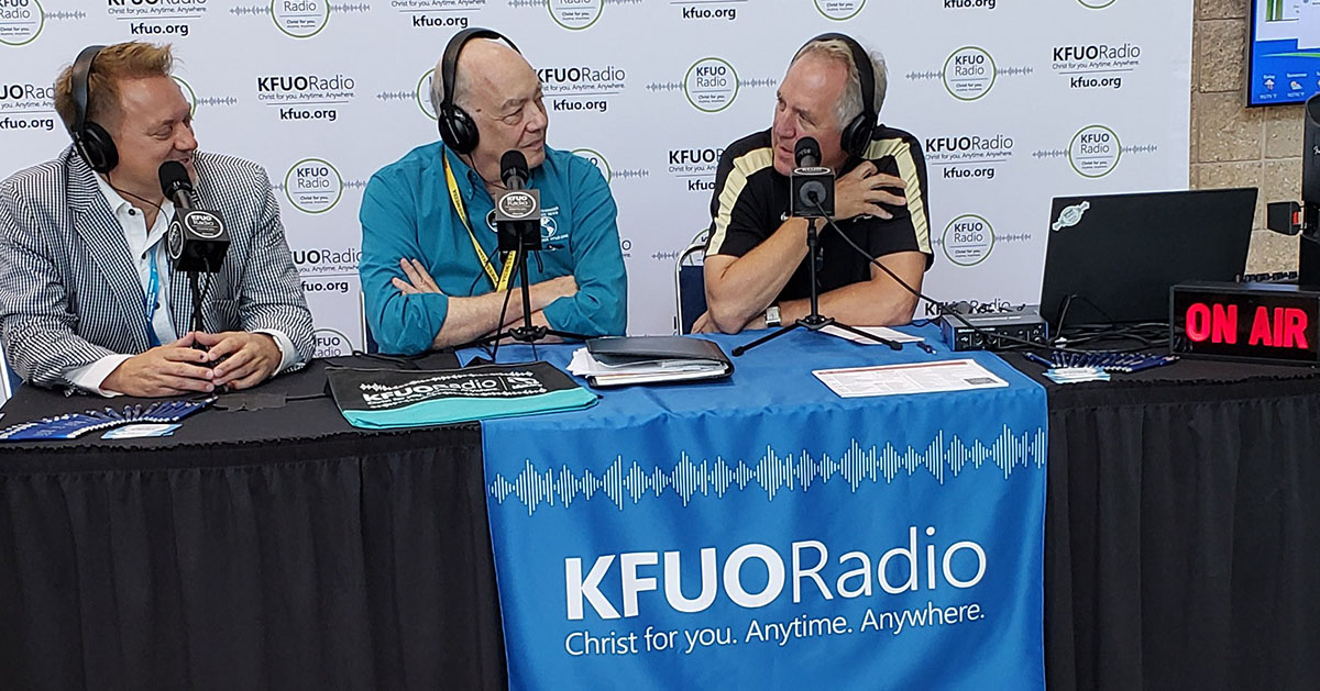 Rev. Dr. Greg Seltz, Executive Director of the Lutheran Center for Religious Liberty, and Congressman John Shimkus, U.S. Representative for Illinois' 15th congressional district, talk with Kip Allen at the 67th Regular Convention of the LCMS.