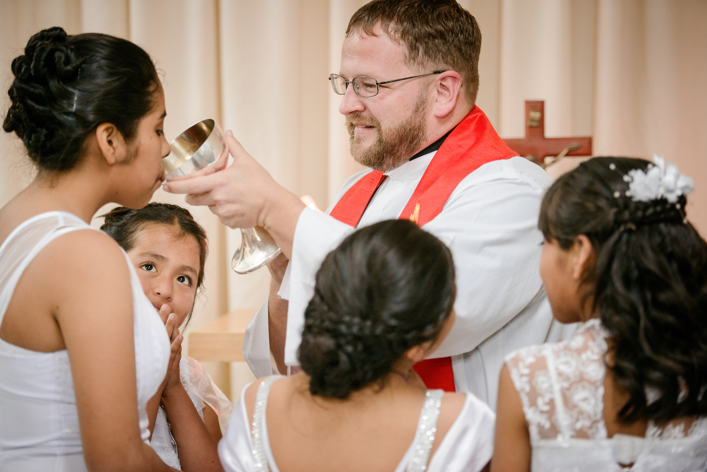 The Rev. Eddie Hosch, LCMS career missionary to Peru, distributes the Sacrament for the first time to new confirmand Naomi at Castillo Fuerte on Saturday, Nov. 4, 2017, in the La Victoria district of Lima, Peru. LCMS Communications/Erik M. Lunsford