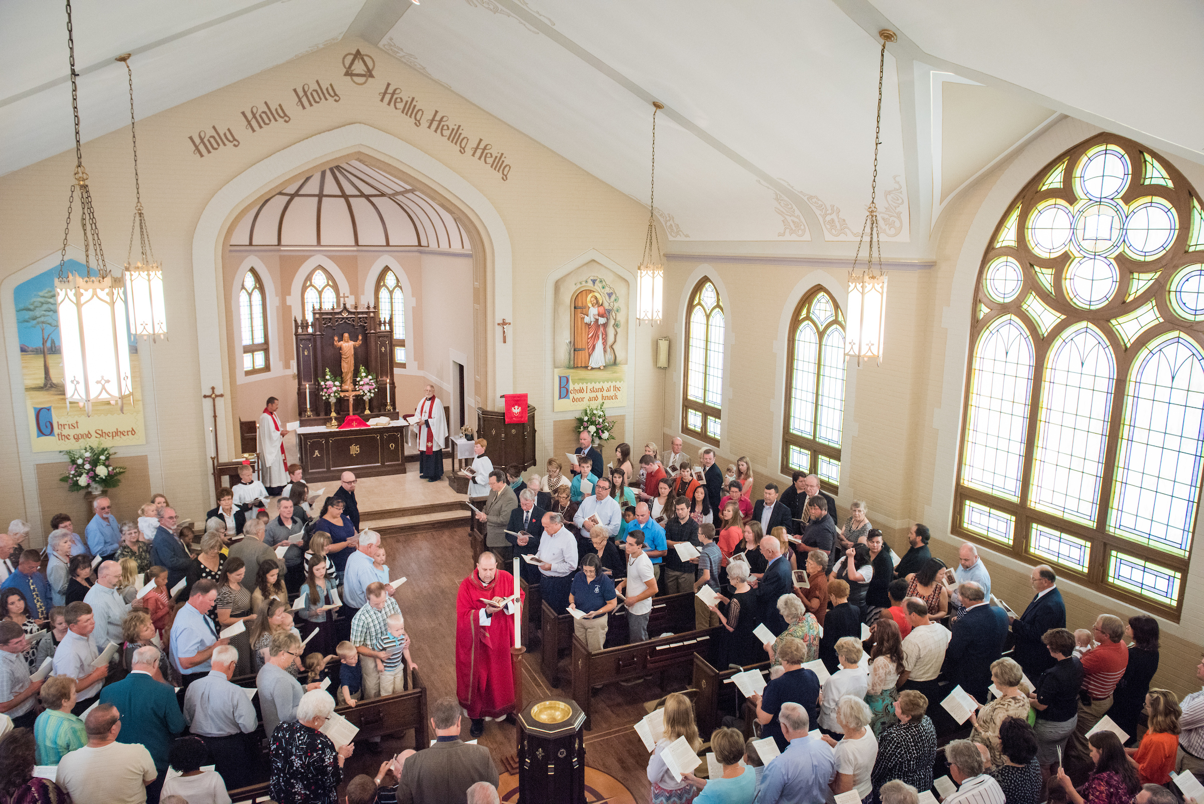 The Rev. Benjamin Ball blesses the baptismal font during a Divine Service of Rededication at St. Paul Lutheran Church in Hamel, Ill., on Sunday, Sept. 7, 2014. LCMS Communications/Erik M. Lunsford