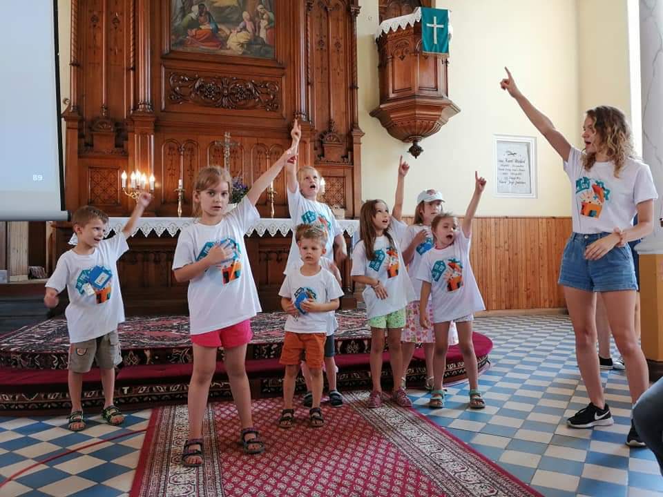 Katie Scherger, Short-term volunteer for the English Bible Camp in Konin, Poland, in August 2019, sings songs with campers.