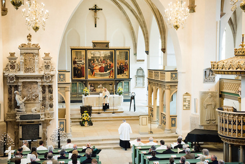 The Rev. Dr. Michael Kumm, chairman of the LCMS Board of Directors, kneels at the altar during the Festival Dedication Service at the Town and Parish Church of St. Mary's before the dedication of The International Lutheran Center at the Old Latin School on Sunday, May 3, 2015, in Wittenberg, Germany. LCMS Communications/Erik M. Lunsford